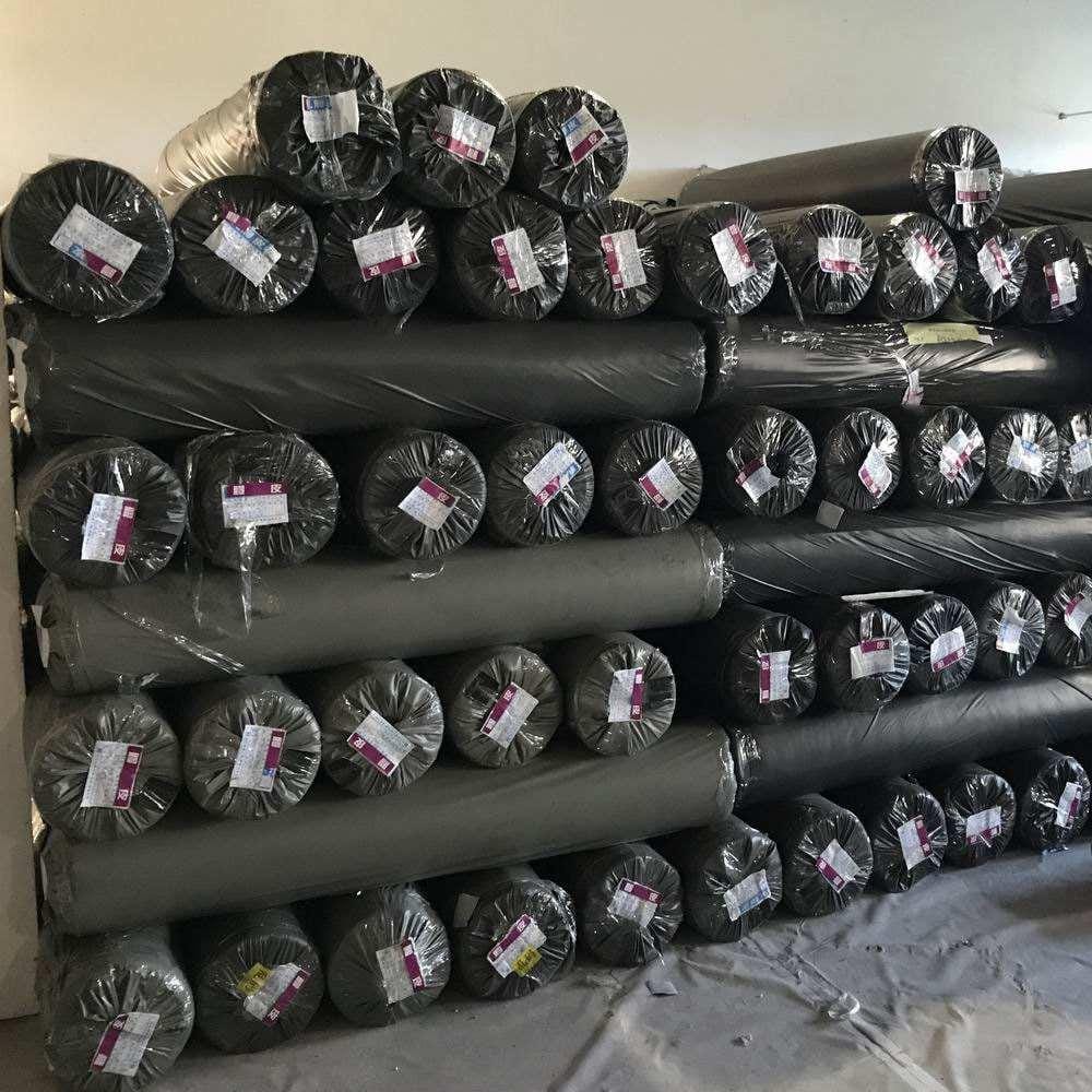 Stacked black and grey PVC leather surplus rolls