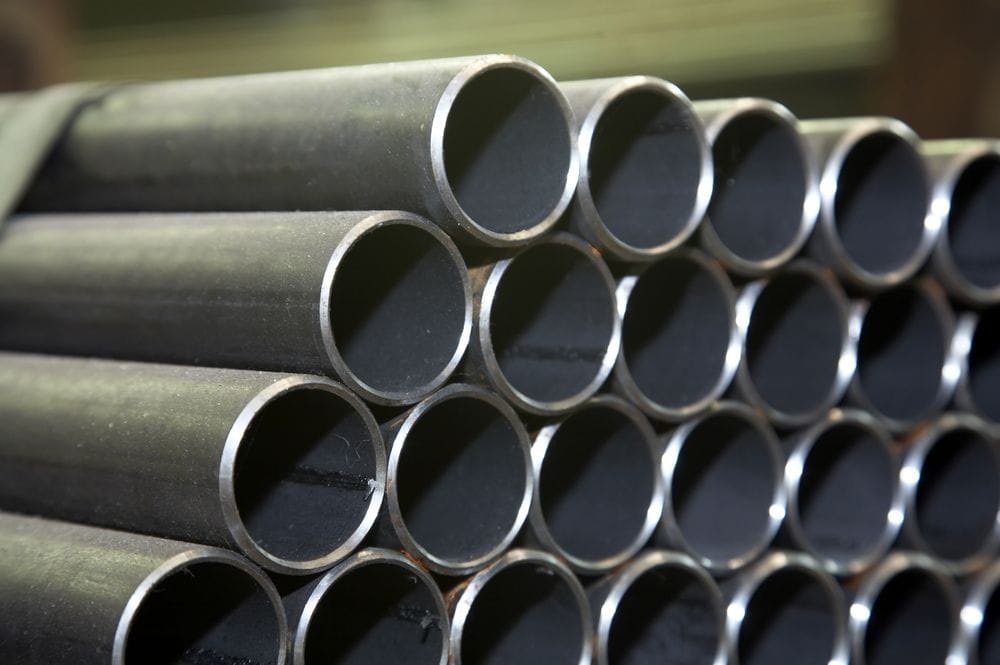 Bundle of carbon steel pipes showing cut ends and wall thickness