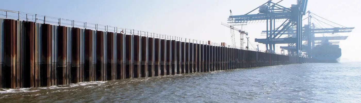 Port construction using steel sheet piles