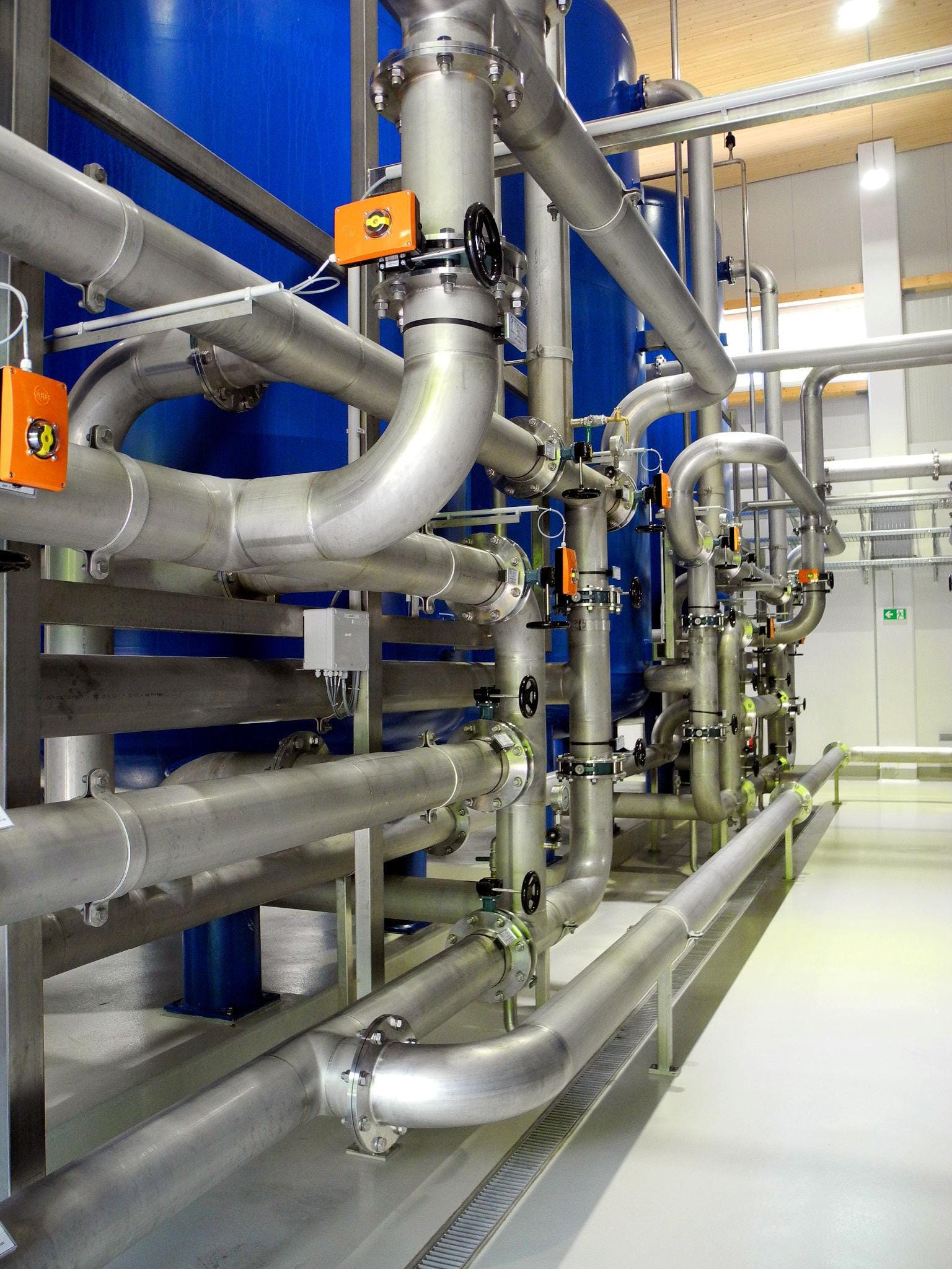 Water treatment plant piping with stainless steel tube